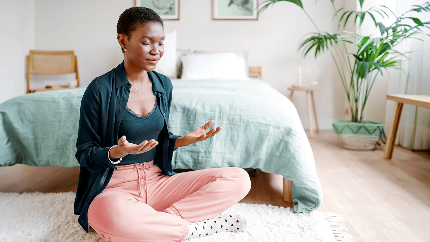 Person practicing calm yoga and breathwork in a bright studio